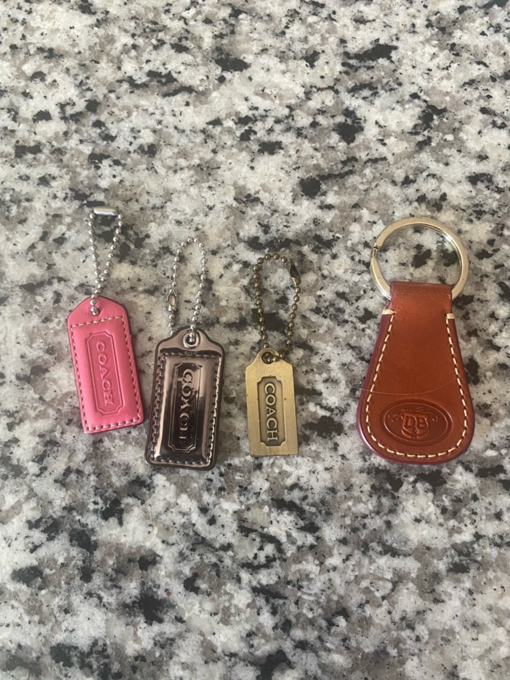 Coach and Dooney & Bourke bag tags